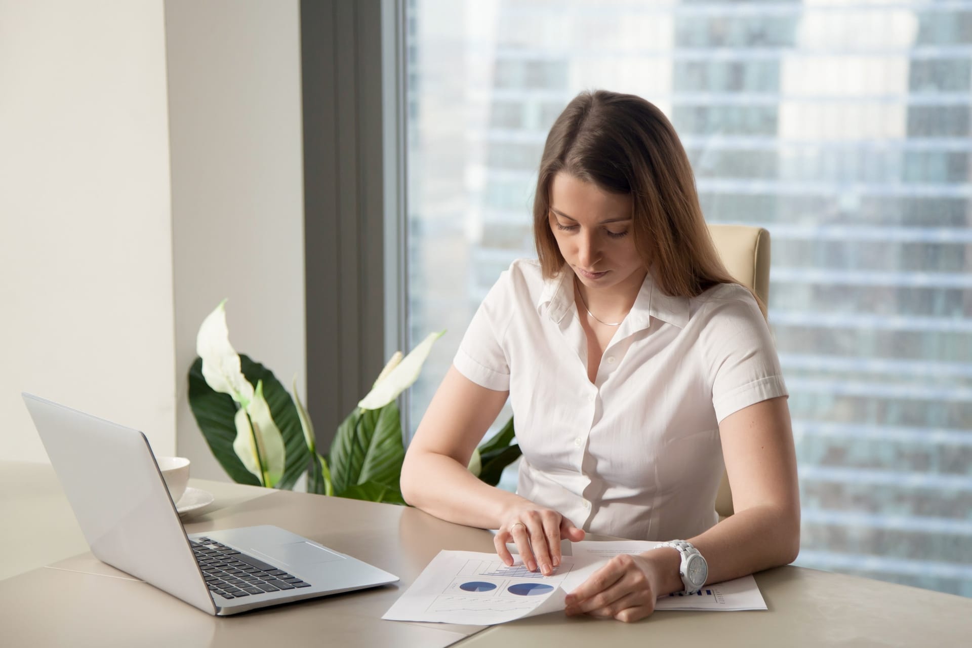 A quiet desk with handwritten notes and a ledger — the thoughtful work of rights accounting